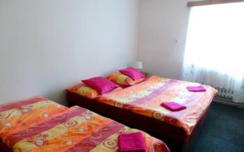 Čtyřlůžkový pokoj se společnou koupelnou