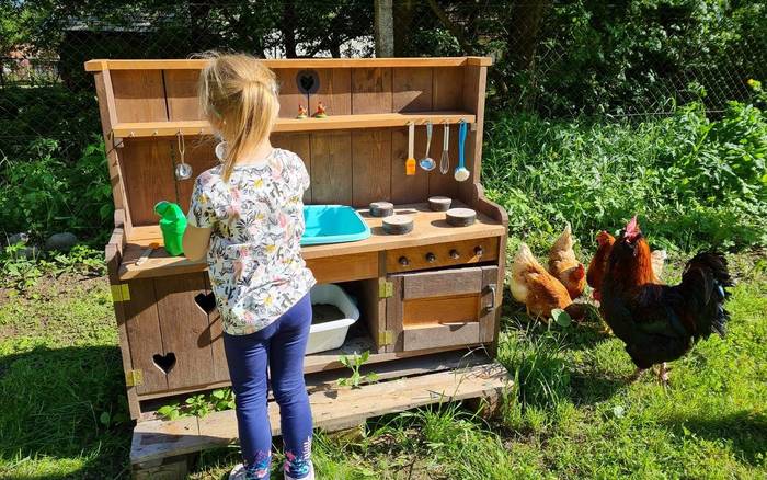 Playing with the mud kitchen