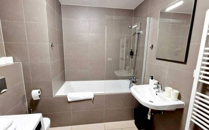 Studio 1+kk a balkonem s manželskou postelí