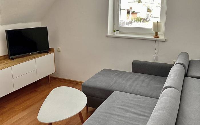 4-lôžkový apartmán - obývacia miestnosť